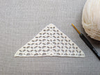 Detailed view of finished edge and lace stitch pattern on a triangle crochet bandana shawl, Chart 8.