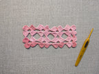 Detailed view of seamless motif joins and finished edging on a crochet shawl, Chart 9.