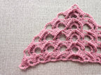 Detailed view of finished edge and sophisticated stitch pattern on a triangle crochet bandana shawl, Chart 15.