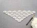 Detailed view of finished edge and lace stitch pattern on a triangle Baktus crochet scarf, Chart 17.