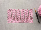 Detailed view of finished edge and lace stitch pattern on a crochet scarf, Chart 19.