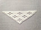 Detailed view of finished edge and lace stitch pattern on a triangle crochet bandana shawl, Chart 22.