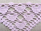 Detailed view of finished edge and lace stitch pattern on a triangle crochet bandana shawl, Chart 28.