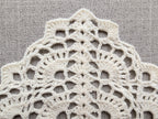 Detailed view of finished edge and lace stitch pattern on a triangle crochet bandana shawl, Chart 30.