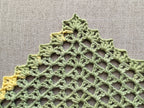 Detailed view of finished edge and lace stitch pattern on a triangle crochet bandana shawl, Chart 32.