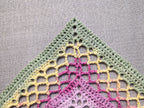 Detailed view of finished edge and lace stitch pattern on a triangle crochet bandana shawl, Chart 36.