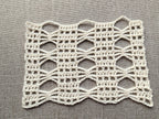 Detailed view of finished edge and lace stitch pattern on a crochet scarf, Chart 42.