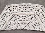 Detailed view of finished edge and lace stitch pattern on a trapezoid crochet shawl, Chart 44.