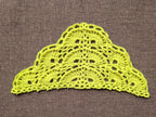 Detailed view of finished edge and lace stitch pattern on a triangle crochet shawl, Chart 56.