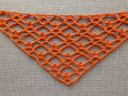 Detailed view of finished edge and lace stitch pattern on a triangle crochet bandana shawl, Chart 61.