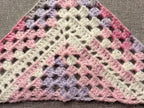 Detailed view of finished edge and lace stitch pattern on a triangle crochet bandana shawl, Chart 63.