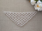 Detailed view of finished edge and lace stitch pattern on a triangle crochet bandana shawl, Chart 65.