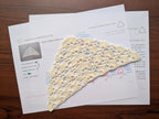 Detailed view of finished edge and lace stitch pattern on a triangle crochet bandana shawl, Chart 70.