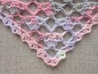 Detailed view of decorative custom border edging on a triangle crochet bandana shawl, Chart 77.