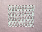 Detailed view of finished edge and lace stitch pattern on a crochet scarf, Chart 81.