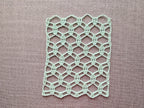 Detailed view of finished edge and lace stitch pattern on a crochet scarf, Chart 82.