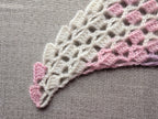 Detailed view of decorative custom border edging on a half-circle crochet baktus, Chart 83.