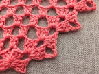 Close-up shot of center increase pattern and corner details on crochet triangle shawl Chart 95.