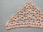 Detailed view of finished edge and lace stitch pattern on a triangle crochet bandana shawl, Chart 45.
