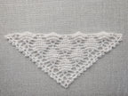 Detailed view of finished edge and lace stitch pattern on a triangle crochet bandana shawl, Chart 67.