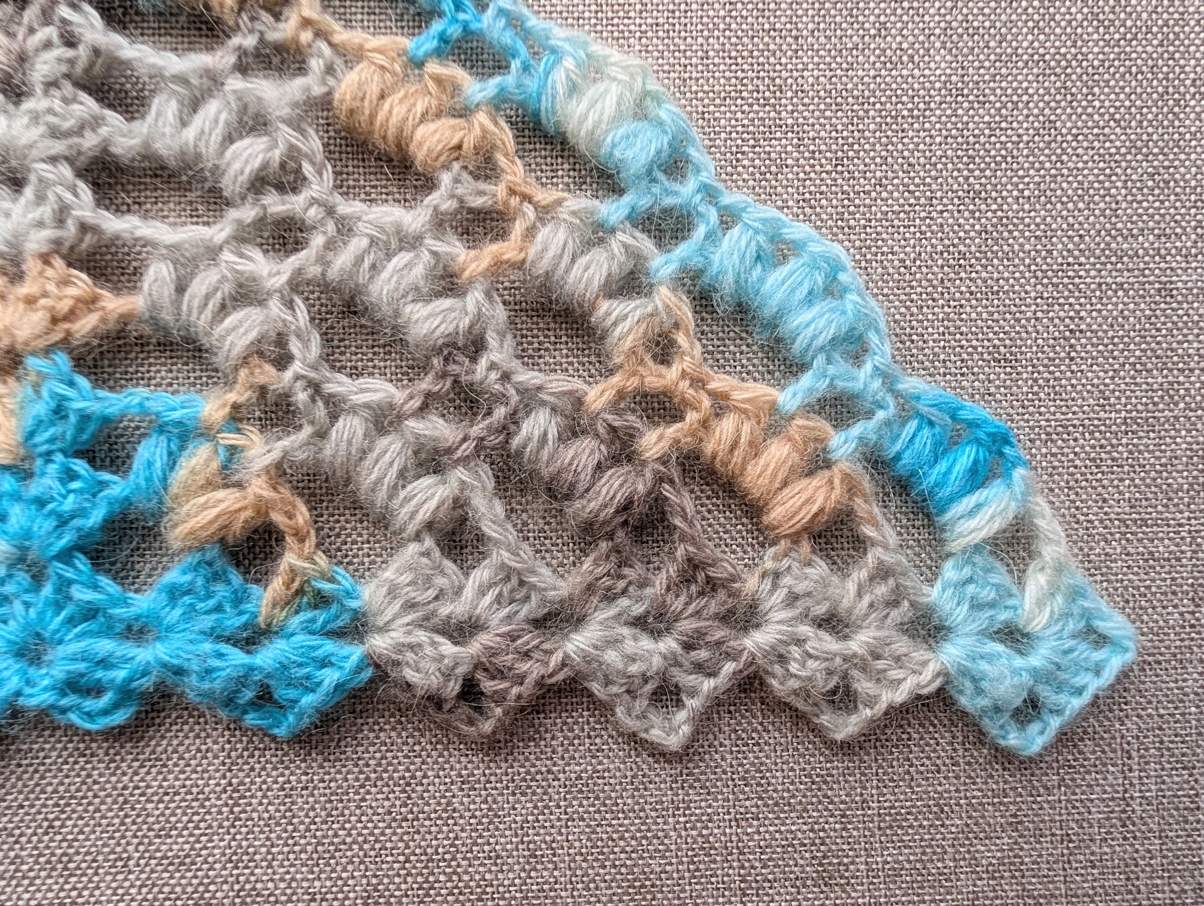 Chart 107 crochet symbol guide and stitch key for intermediate winter triangle scarf pattern using 2-hdc and 3-hdc puff cluster stitches.