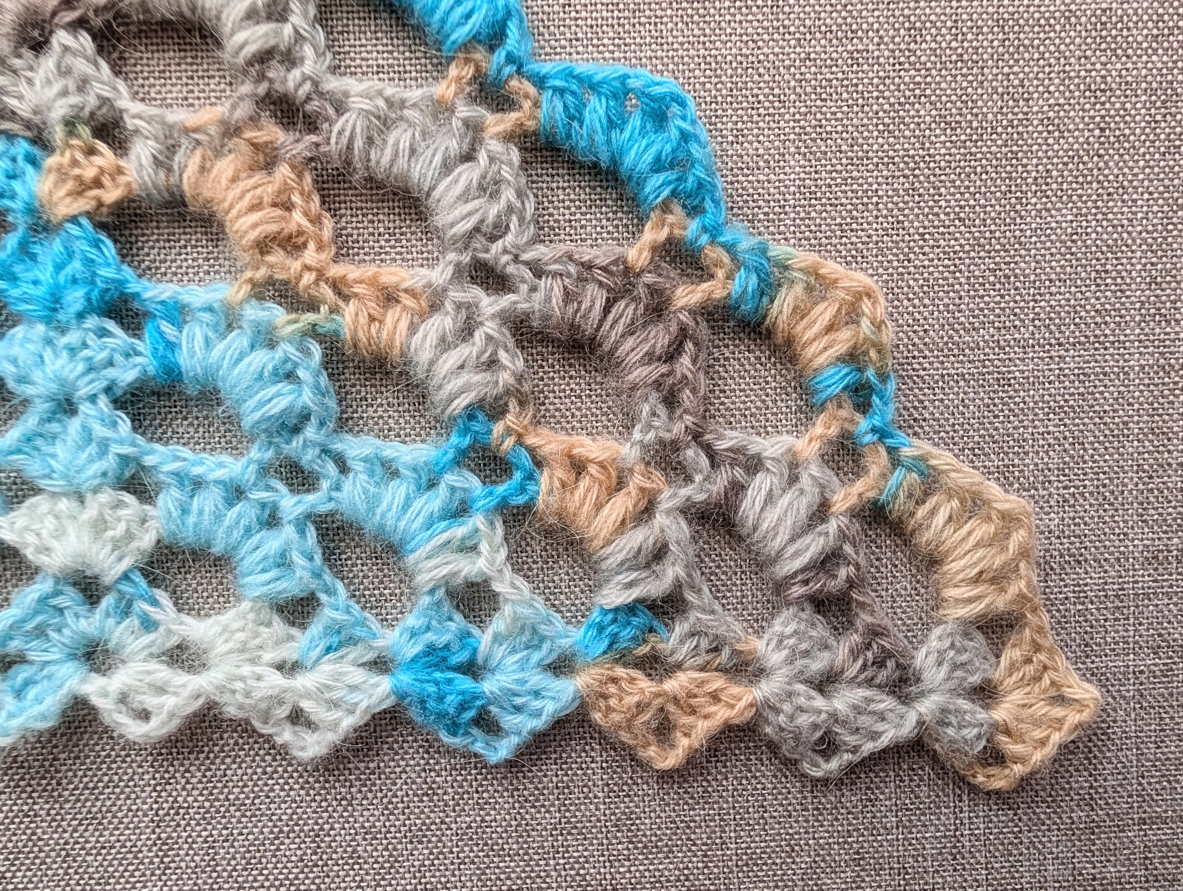 Crochet stitch key and symbol chart 107 for intermediate winter triangle scarf PDF pattern, featuring vector symbol definitions and abbreviations.