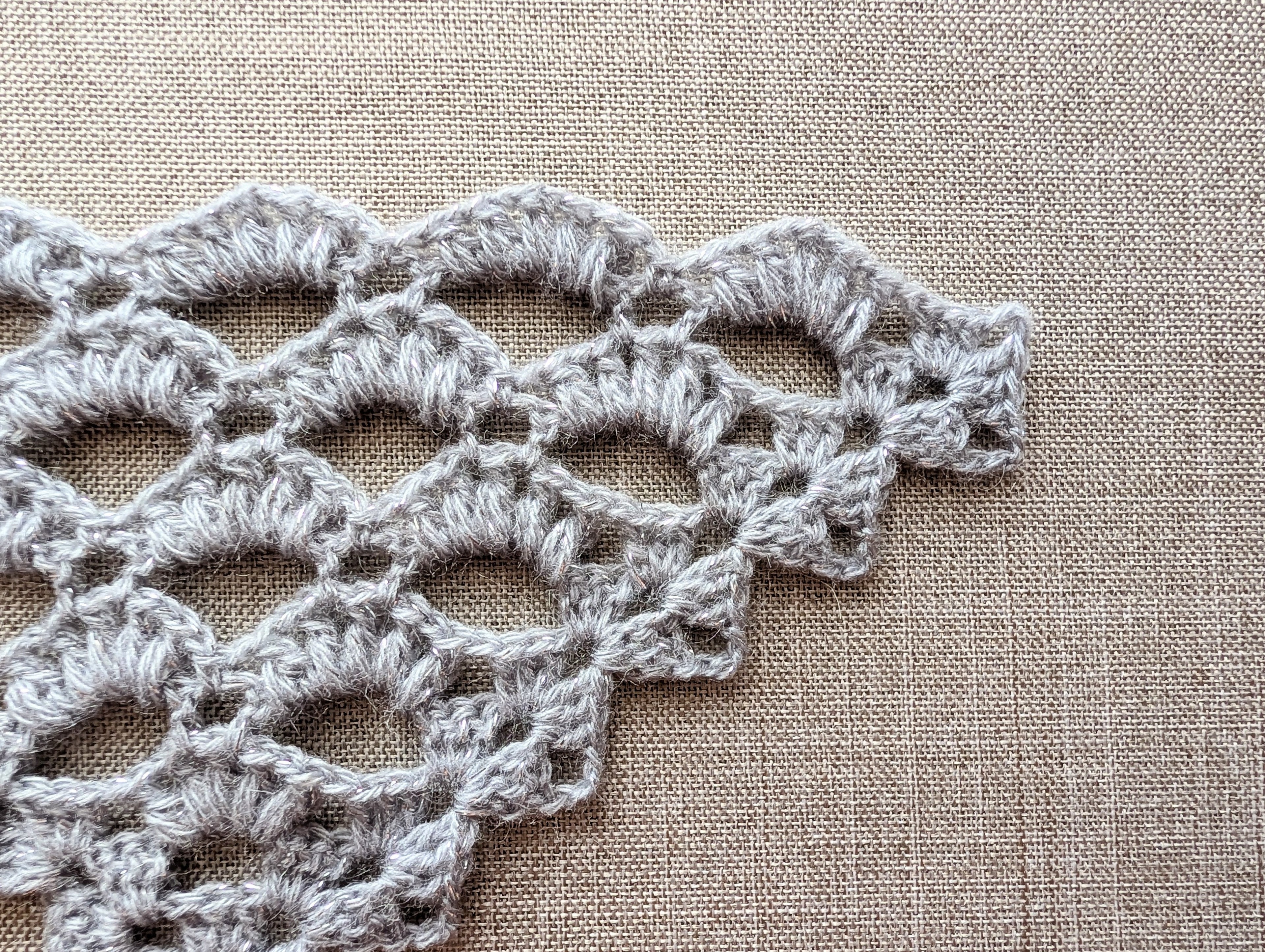 Stitch symbol reference guide for Chart 107 in the winter shawl wrap crochet pattern.