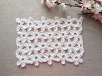 Finished Chart 100 seamless motif crochet wrap styled as a rectangle scarf using continuous technique.