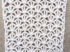 Close-up of Chart 101 openwork lace texture using treble crochet stitches and delicate mesh loops.