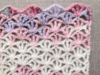 Detailed close-up of Chart 101 openwork lace stitches showing delicate treble crochet mesh fabric.