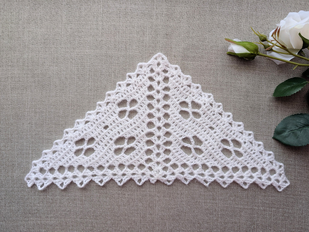 Handmade filet crochet lace bandana shawl featuring delicate floral motifs and a decorative shell border, Pattern #104.