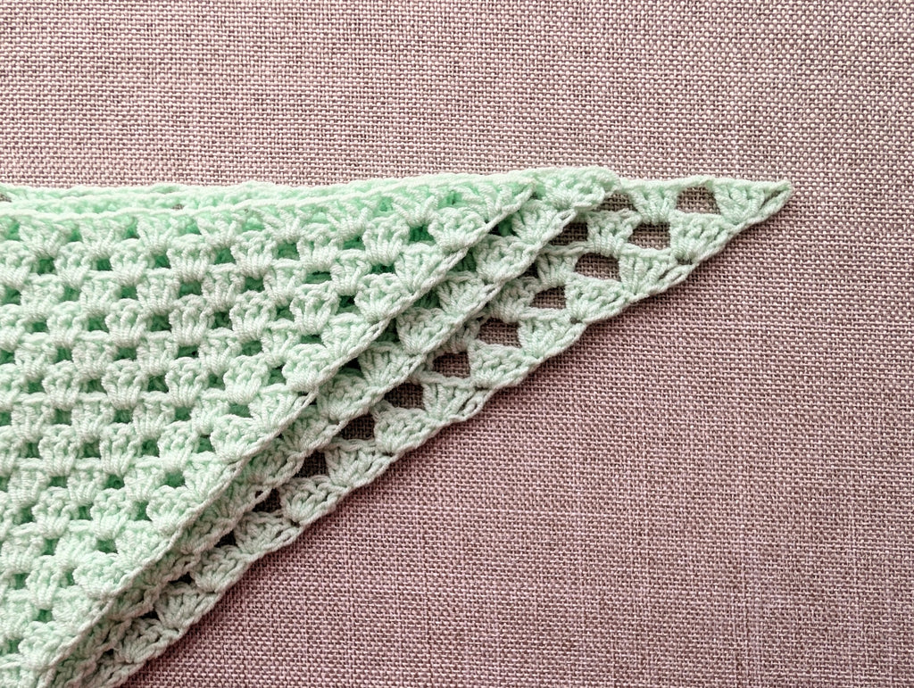 Crochet stitch symbol key displaying chain stitch, double crochet, treble crochet, and green start arrow