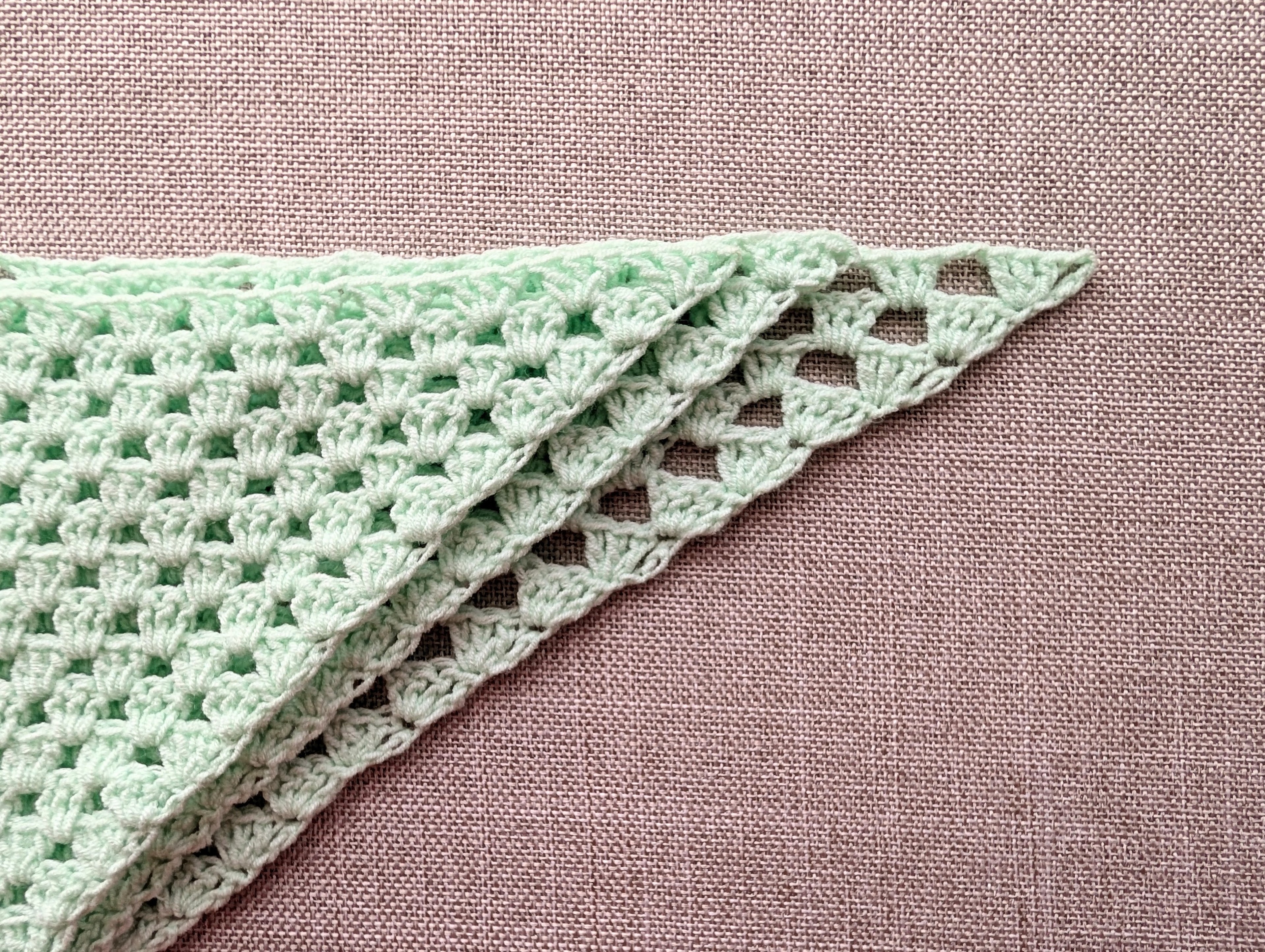 Crochet stitch symbol key displaying chain stitch, double crochet, treble crochet, and green start arrow