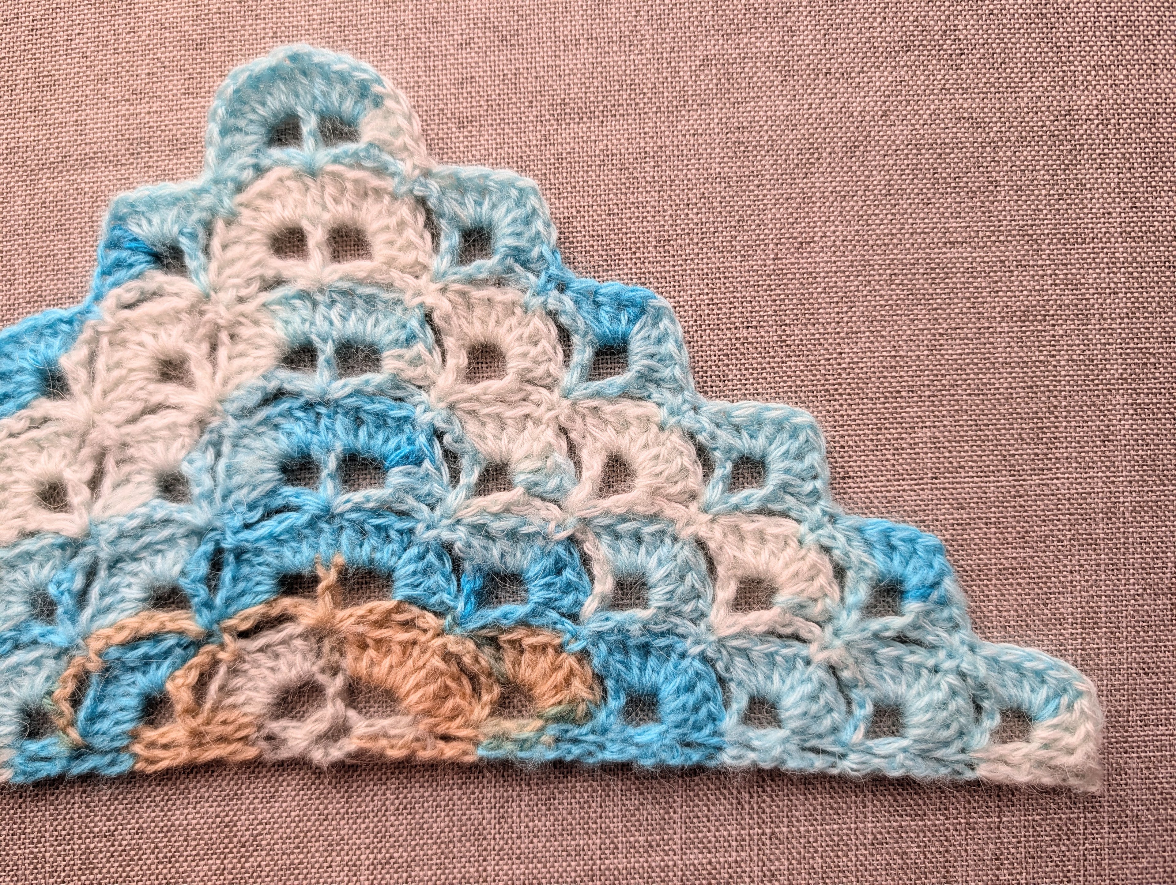 High-contrast symbol chart No. 114 for intermediate crochet dense shell triangle wrap.