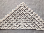 Lightweight beginner-friendly crochet lace neckscarf styled as a triangle kerchief.