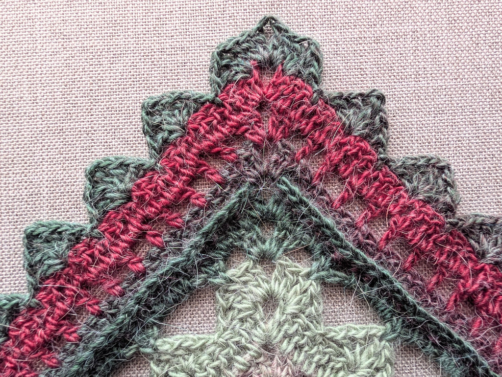 Triangle neck scarf styled as a cozy baktus showing gradient color transitions from pattern #112.