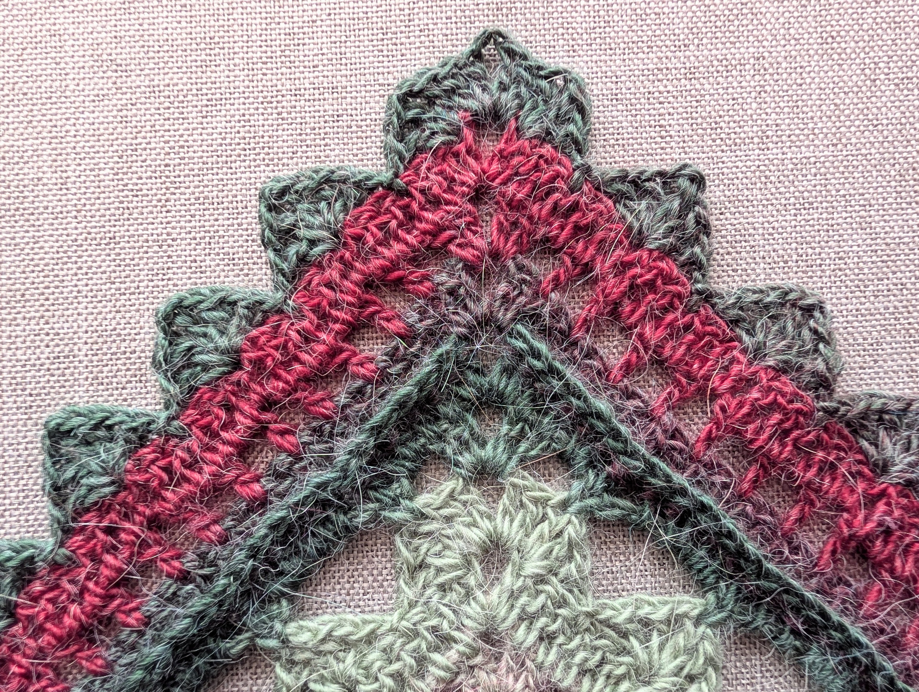 Triangle neck scarf styled as a cozy baktus showing gradient color transitions from pattern #112.