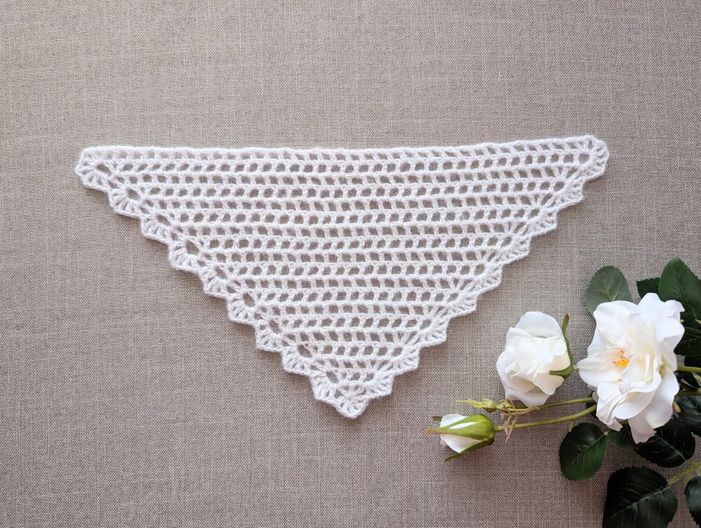 Lace triangle crochet bandana shawl featuring a decorative border, Chart 99.