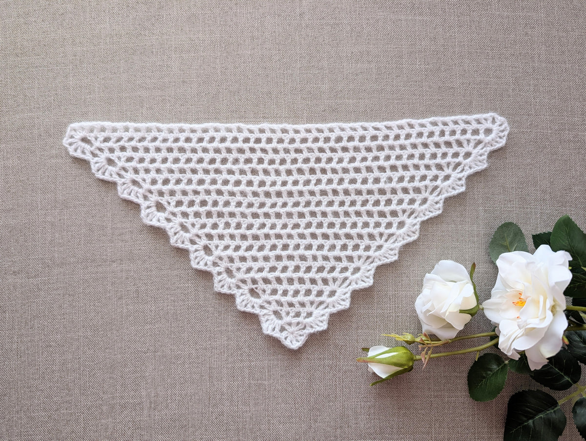 Lace triangle crochet bandana shawl featuring a decorative border, Chart 99.