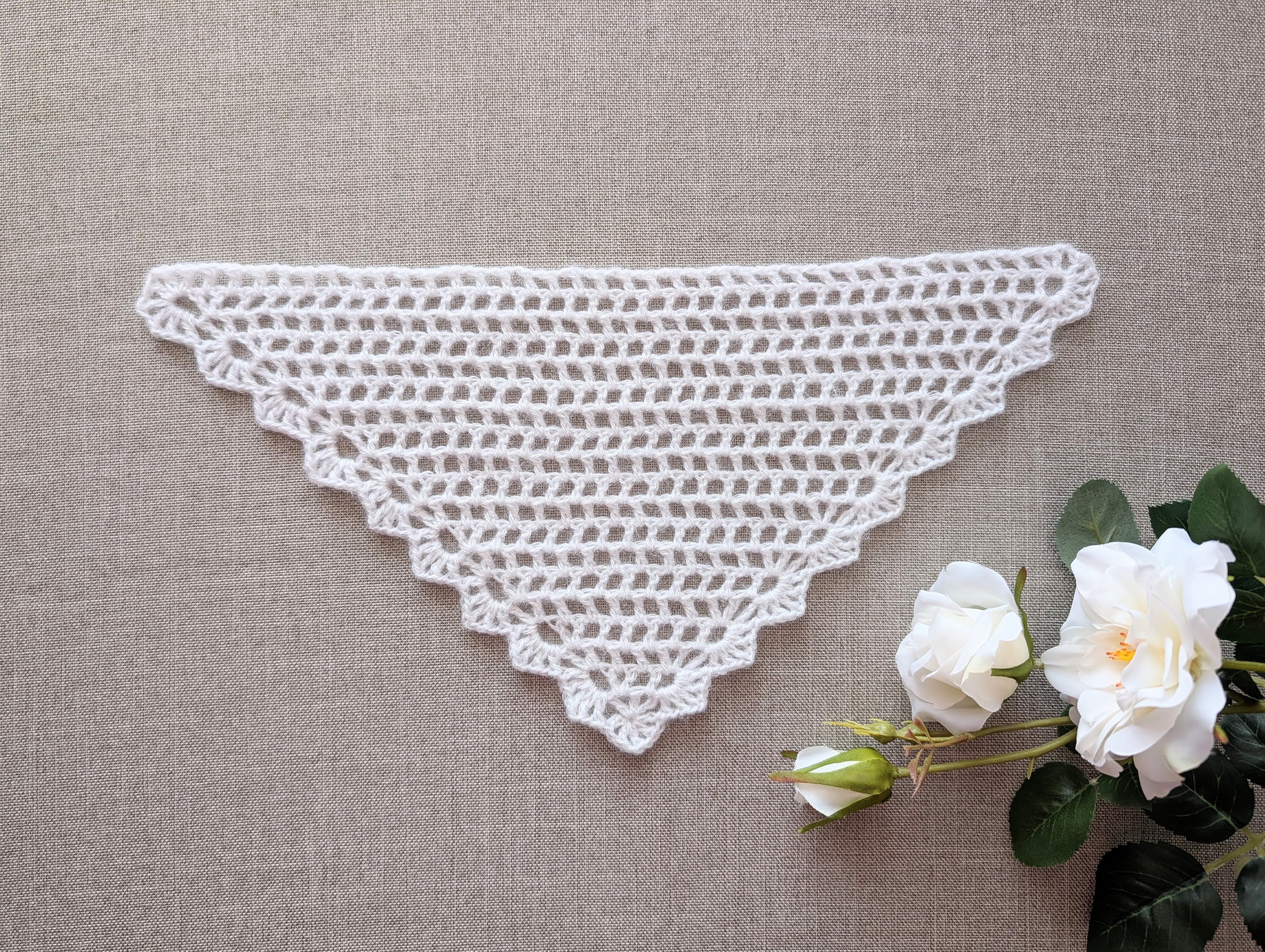 Lace triangle crochet bandana shawl featuring a decorative border, Chart 99.