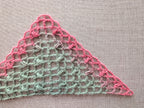Close-up detail of Chart #98 3-dc and 3-hdc cluster stitches creating a light airy mesh texture in a handmade crochet shawl.