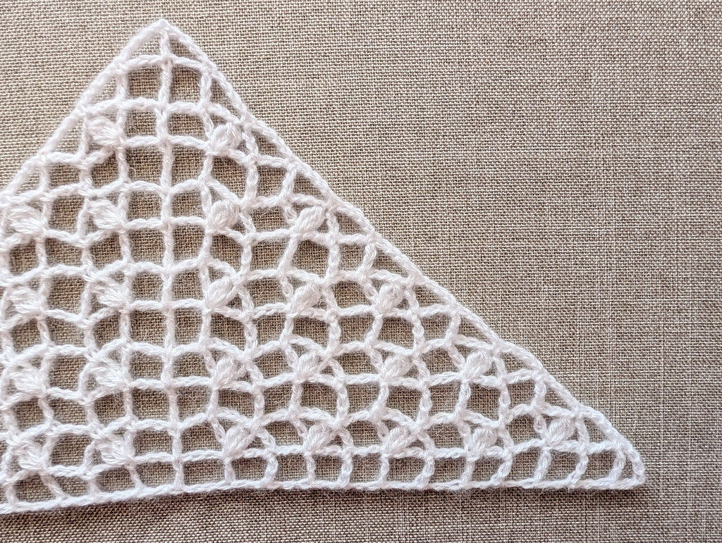 Handmade crochet bactus triangle scarf from PDF Chart #98 displayed to show light mesh drape.
