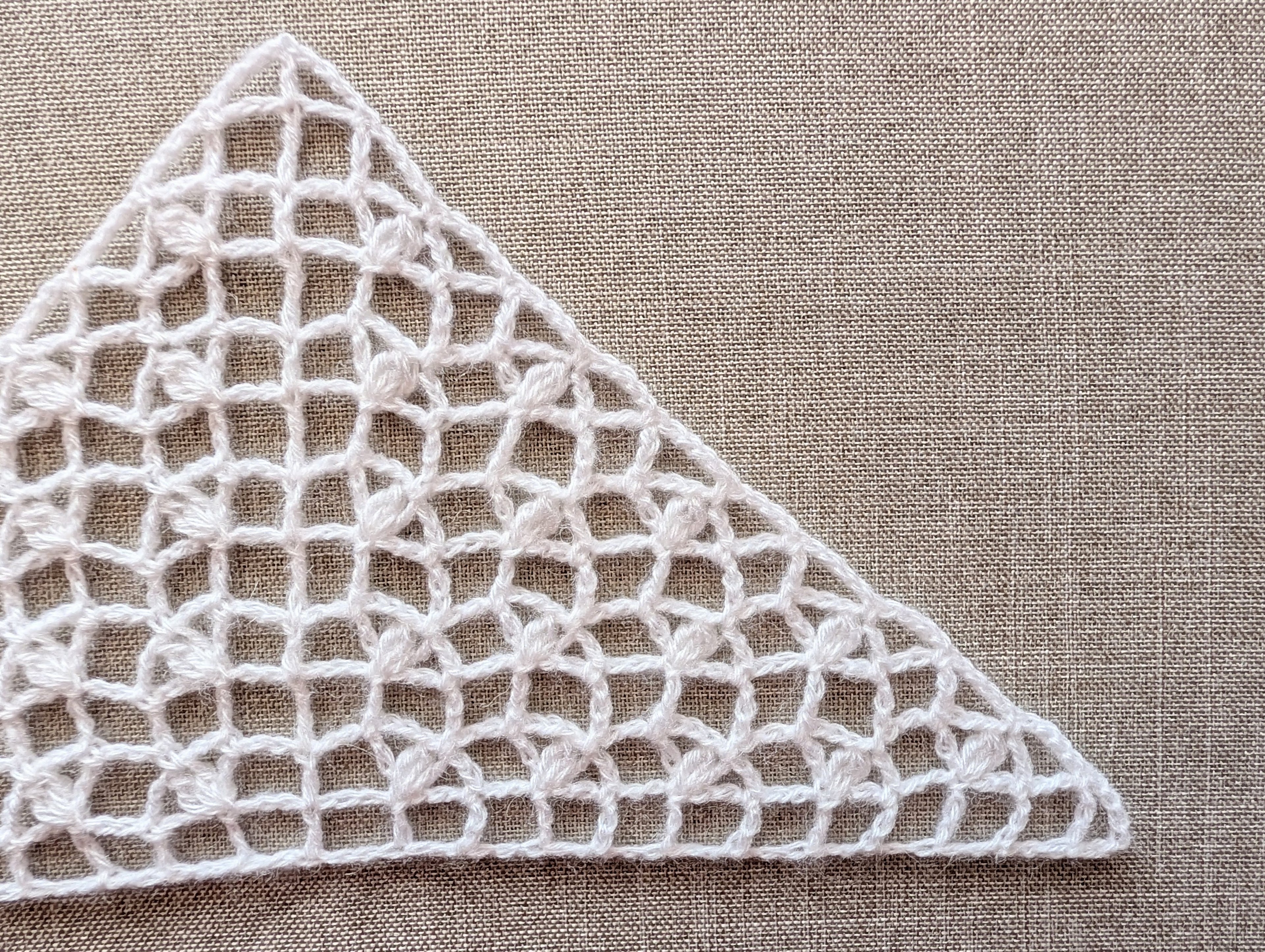 Handmade crochet bactus triangle scarf from PDF Chart #98 displayed to show light mesh drape.