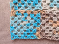 Close-up view of seamless continuous join-as-you-go granny square motifs connected without sewing or seams.