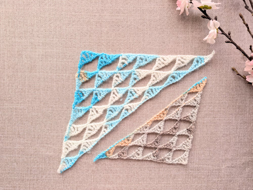 Wide-form crocheted baktus triangle shawl using Chart 111